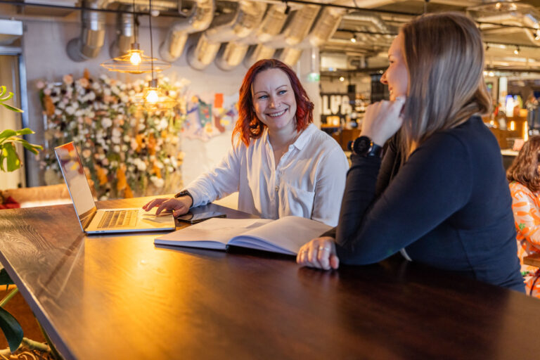 Two women sharing their business success in Finland